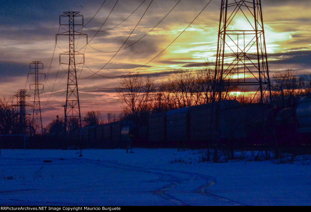 Train passing by at the sunset